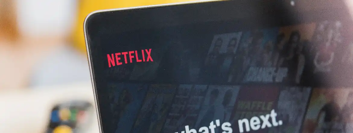 laptop showing the netflix tv channel and its logo